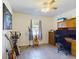 Bedroom with wood desk, musical instruments, and window at 200 Holland Street, Lake Wales, FL 33859