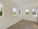 Bright bedroom with wood-look floors and multiple windows at 200 Holland Street, Lake Wales, FL 33859