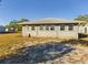 Tan house exterior with large windows and grassy yard at 200 Holland Street, Lake Wales, FL 33859