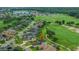 Aerial view highlighting proximity to community amenities and a golf course, enhancing the lifestyle appeal at 7330 Reflections Lake Dr, Lakeland, FL 33813