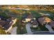 Stunning home with lush landscaping and a grand driveway, set against the backdrop of a picturesque golf course at 7330 Reflections Lake Dr, Lakeland, FL 33813