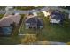 Beautiful home with a spacious lawn, patio, and balcony overlooking a serene neighborhood street at 7330 Reflections Lake Dr, Lakeland, FL 33813
