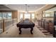 Spacious game room with a pool table, bar, and plenty of room for entertaining guests at 7330 Reflections Lake Dr, Lakeland, FL 33813