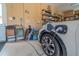 Well-lit garage interior with an electric vehicle charging station, alongside ample space for parking and storage at 7330 Reflections Lake Dr, Lakeland, FL 33813