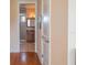 A hallway leads to the bathroom featuring tiled walls and shower at 7330 Reflections Lake Dr, Lakeland, FL 33813