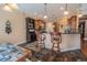 Cozy kitchen with dark countertops, matching bar stools, and modern pendant lighting at 7330 Reflections Lake Dr, Lakeland, FL 33813