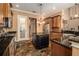 Kitchen with island, stainless steel appliances, and dark granite countertops at 7330 Reflections Lake Dr, Lakeland, FL 33813