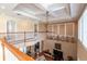 View of a living room featuring high ceilings, a large window, and multiple instruments displayed on the wall at 7330 Reflections Lake Dr, Lakeland, FL 33813
