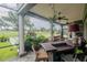 Covered patio with an outdoor bar area and a beautiful view of the golf course at 7330 Reflections Lake Dr, Lakeland, FL 33813