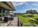 Scenic patio view overlooking the meticulously landscaped golf course, providing a tranquil outdoor living space at 7330 Reflections Lake Dr, Lakeland, FL 33813