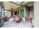 Outdoor patio with wicker furniture, ceiling fans, and a barbecue grill, perfect for entertaining at 7330 Reflections Lake Dr, Lakeland, FL 33813