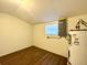 Utility room with water heater, window and laminate flooring at 3523 Colleen Dr, Lakeland, FL 33810