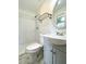 Bathroom featuring a tub and shower, toilet, and a vanity with a sink at 3523 Colleen Dr, Lakeland, FL 33810