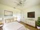 Cozy bedroom featuring white furniture, tile floors, and a ceiling fan at 3523 Colleen Dr, Lakeland, FL 33810