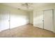 Bright bedroom featuring tile floors, a ceiling fan, and a double door closet at 3523 Colleen Dr, Lakeland, FL 33810