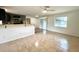 Bright living room featuring tile floors, neutral walls, and sliding glass doors to the backyard at 3523 Colleen Dr, Lakeland, FL 33810