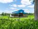 Exterior view of the barn with a horse logo and ample space for livestock at 1096 Drew St, Lakeland, FL 33810