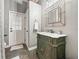 Elegant bathroom featuring an antique vanity with custom mirror, and an exterior exit at 1096 Drew St, Lakeland, FL 33810