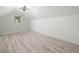Bright bedroom boasts modern ceiling fan, light gray walls and stunning wood-look laminate flooring at 1096 Drew St, Lakeland, FL 33810