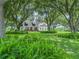 Charming single Gathering home with lush landscaping and mature trees offering beautiful curb appeal at 1096 Drew St, Lakeland, FL 33810