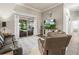 Inviting living room featuring a large sliding glass door to the patio and comfortable leather seating at 1096 Drew St, Lakeland, FL 33810