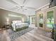 Bright and airy main bedroom with a view of the pool and a decorative black and white rug at 1096 Drew St, Lakeland, FL 33810