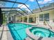 Backyard oasis with pool, spa, outdoor kitchen, and lots of space for entertaining at 1096 Drew St, Lakeland, FL 33810