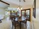 Open concept dining area featuring bar seating and view into the kitchen at 1323 Hammock Shade Dr, Lakeland, FL 33809