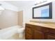 Clean bathroom with granite countertop and a bathtub at 1426 Persimmon Way, Lakeland, FL 33811