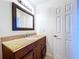 Simple bathroom with granite countertop and single sink vanity at 1426 Persimmon Way, Lakeland, FL 33811