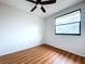 Bedroom with wood flooring, window and ceiling fan at 1426 Persimmon Way, Lakeland, FL 33811