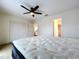 Well-lit bedroom featuring a bathroom and closet at 1426 Persimmon Way, Lakeland, FL 33811