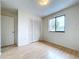 Light bedroom with double door closet and window at 1426 Persimmon Way, Lakeland, FL 33811