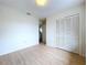 Bedroom with double door closet and access to bathroom at 1426 Persimmon Way, Lakeland, FL 33811