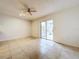 Spacious dining room with tile floors and sliding doors to patio at 1426 Persimmon Way, Lakeland, FL 33811