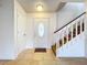 Front entry with white door, glass accents and a staircase at 1426 Persimmon Way, Lakeland, FL 33811