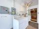 Exterior laundry room with washer, dryer, and cabinets at 1426 Persimmon Way, Lakeland, FL 33811
