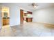 Living room with tile floor and kitchen view at 1426 Persimmon Way, Lakeland, FL 33811
