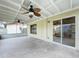 Screened porch with sliding glass doors and ceiling fans at 1426 Persimmon Way, Lakeland, FL 33811