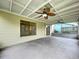 Screened porch with sliding glass doors and ceiling fans at 1426 Persimmon Way, Lakeland, FL 33811