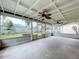 Spacious screened porch with ceiling fans, offering backyard access at 1426 Persimmon Way, Lakeland, FL 33811