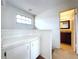 Upstairs hallway with built-in cabinets and bathroom access at 1426 Persimmon Way, Lakeland, FL 33811