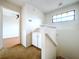 Upstairs hallway with built-in cabinets and bathroom access at 1426 Persimmon Way, Lakeland, FL 33811