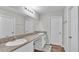 Double vanity bathroom with granite countertop and modern fixtures at 5528 Arlington River Dr, Lakeland, FL 33811