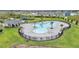 Aerial view of resort-style pool with lounge chairs and cabana at 5528 Arlington River Dr, Lakeland, FL 33811