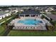 Community pool with plenty of lounge chairs and a cabana at 5528 Arlington River Dr, Lakeland, FL 33811