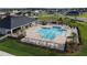 Community pool with surrounding lounge chairs and cabana at 5528 Arlington River Dr, Lakeland, FL 33811