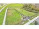Aerial view of fenced dog park with agility equipment at 5528 Arlington River Dr, Lakeland, FL 33811