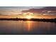Stunning sunset view over a peaceful lake at 5528 Arlington River Dr, Lakeland, FL 33811