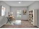 Bright home office featuring a desk, chair, bookshelf, and area rug at 5528 Arlington River Dr, Lakeland, FL 33811